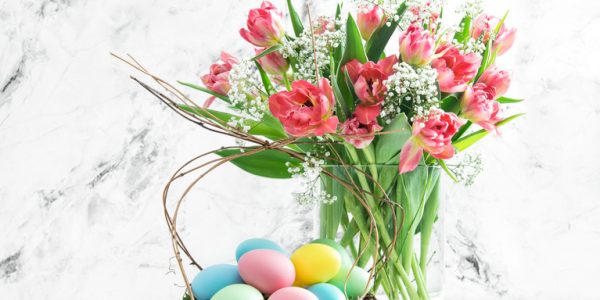 Easter eggs and pink tulips. Spring flowers with easter decoration